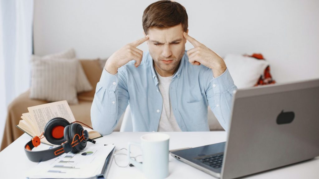 Man unhappy while working from home