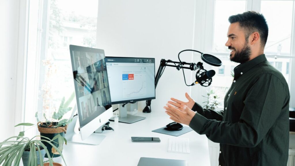 Man talking in microphone on a zoom call while wfh