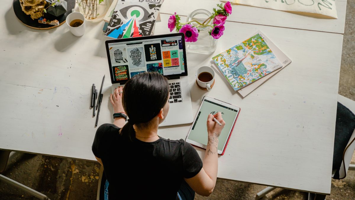 Woman working on business plan at home desk