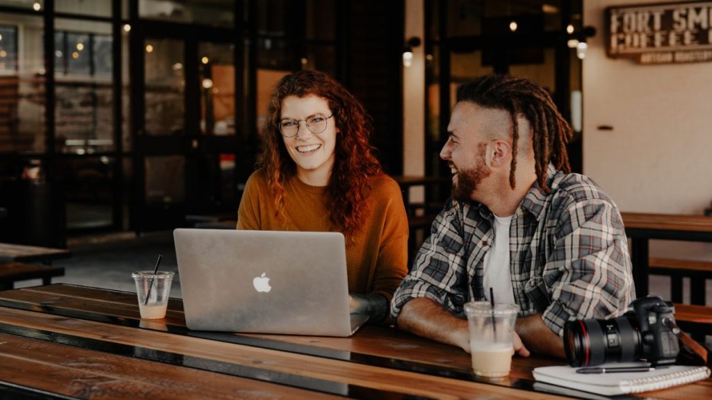 Man and woman working at laptop