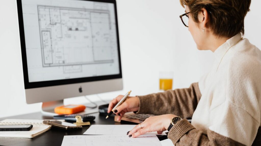 Woman working on computer in home office