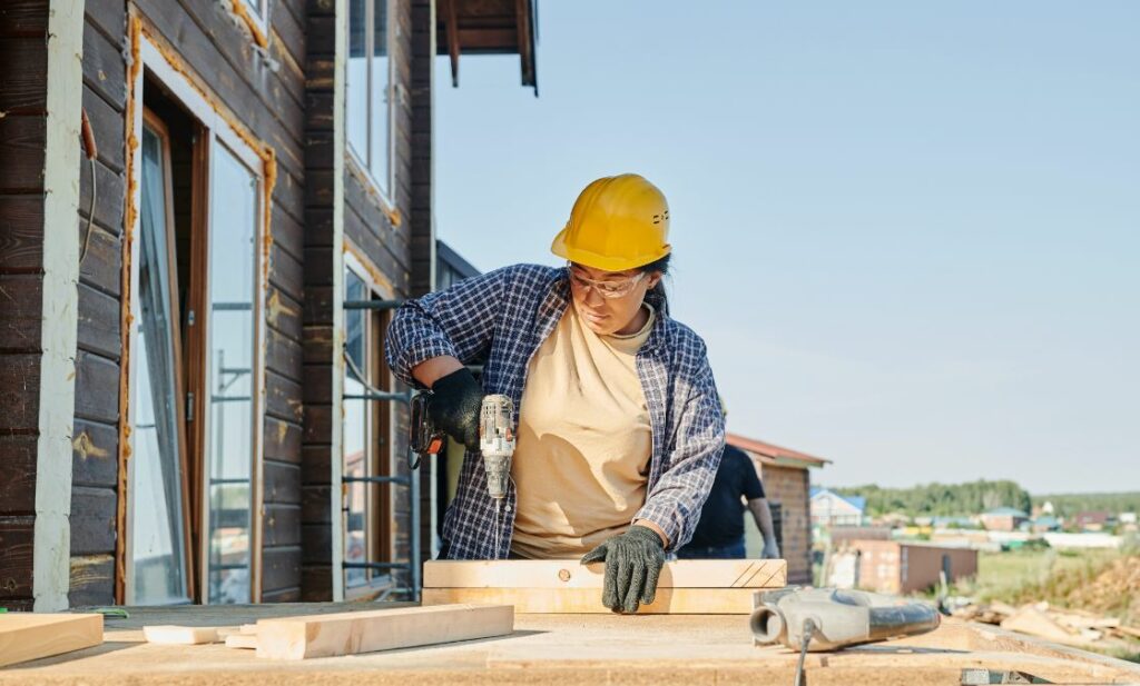 Woman building house