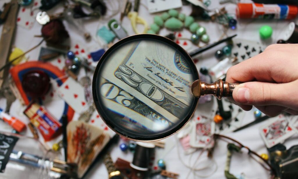 Magnifying glass showing money in lots of products