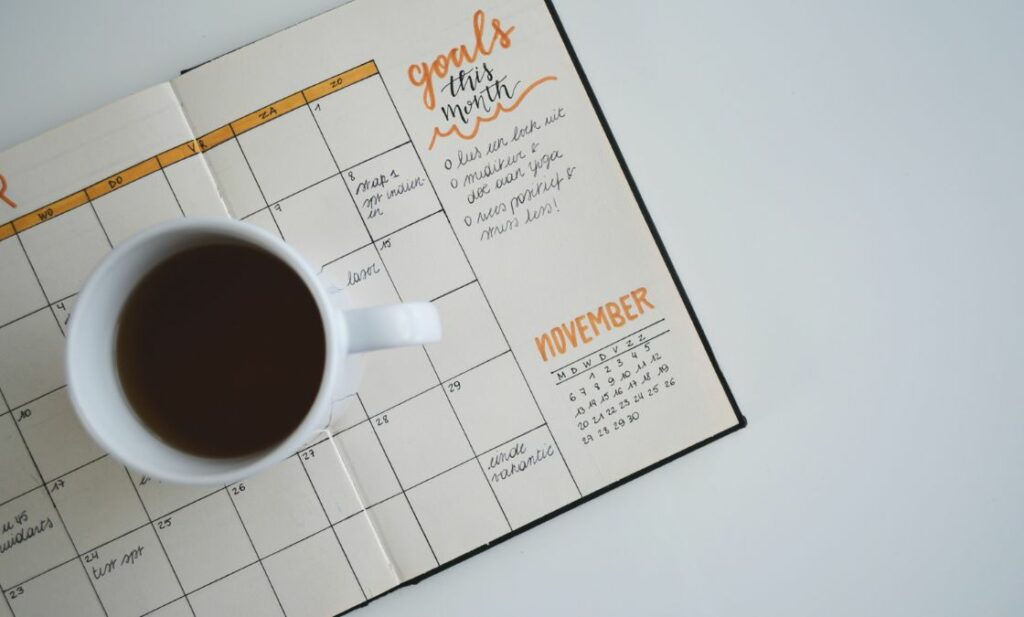 Calendar of goals with coffee cup on it