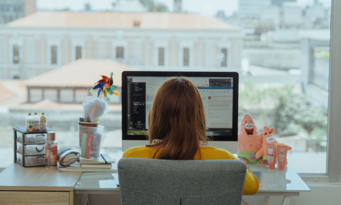 Woman working on computer at home