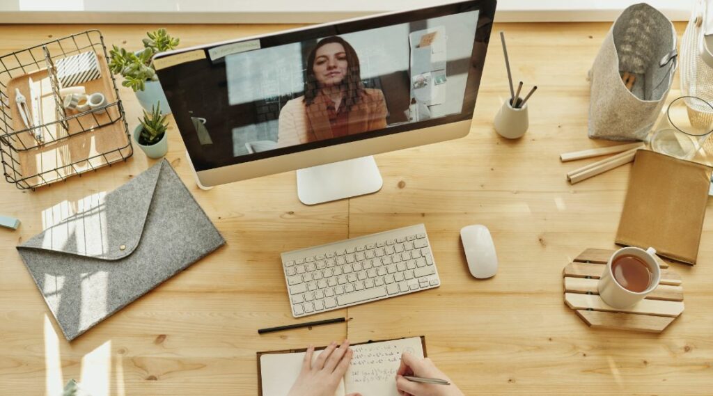 Monitor with woman on zoom meeting