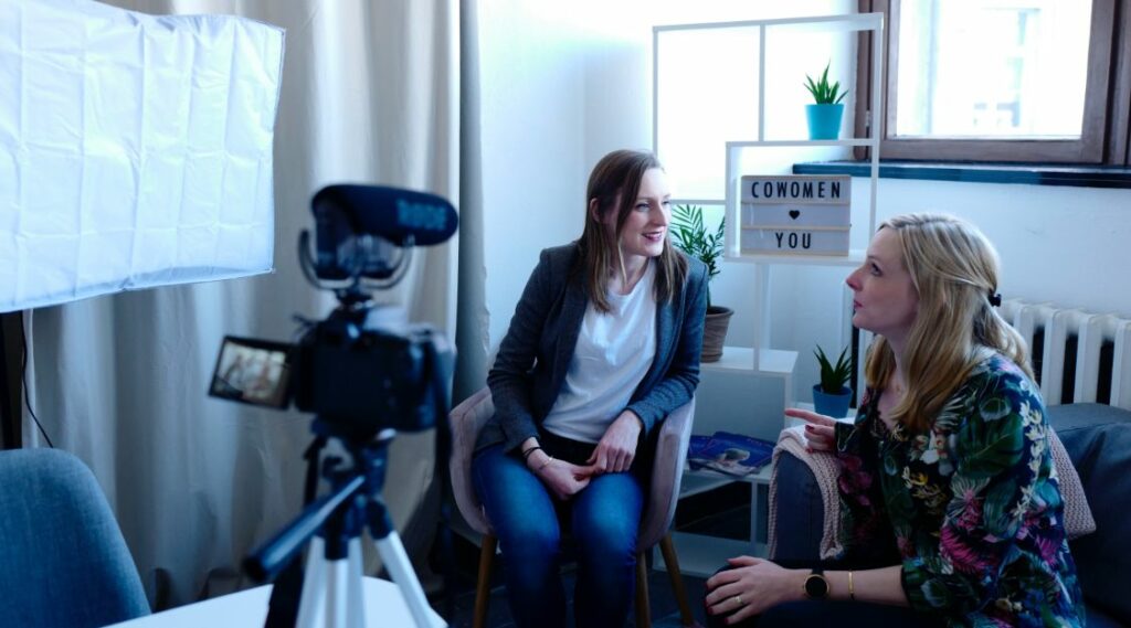 Two ladies making a video in home studio