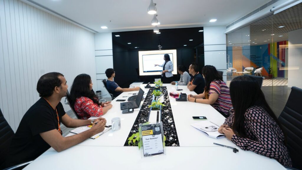 Woman leader having meeting with employees