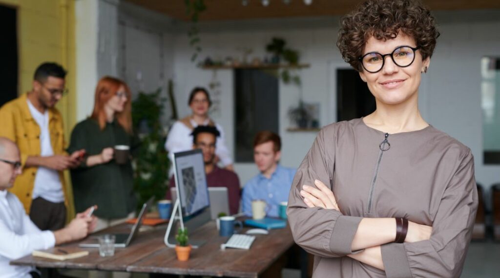 Woman leader in front of team