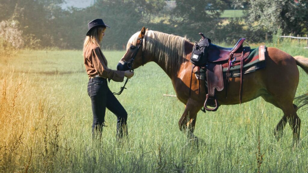 Woman in pasture with horse during self-care time