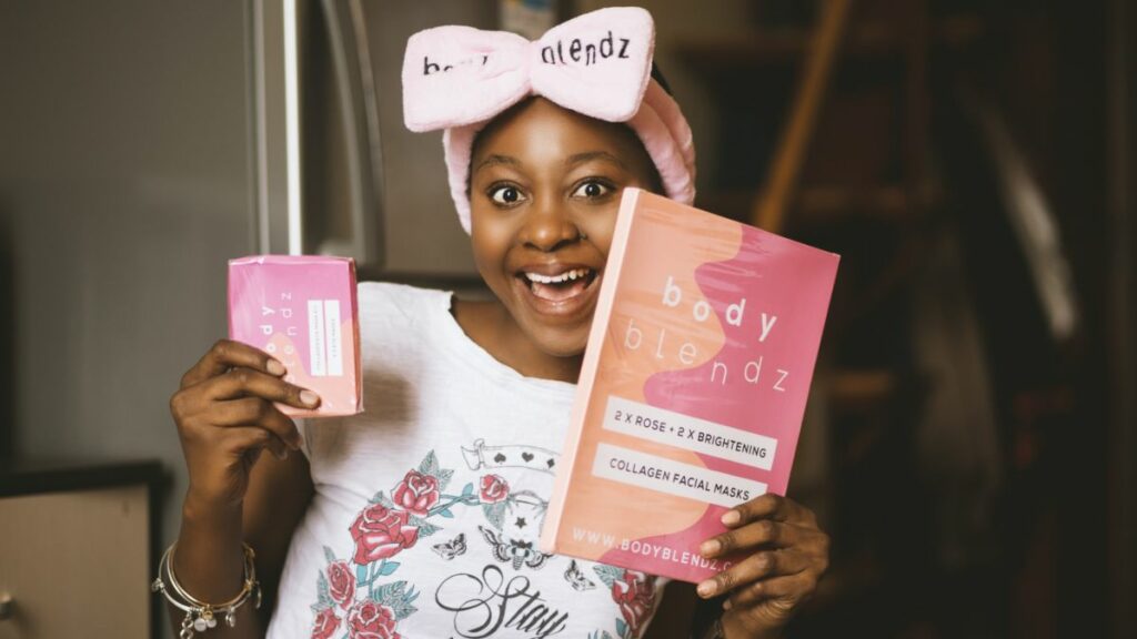 Woman holding book wearing branded outfit