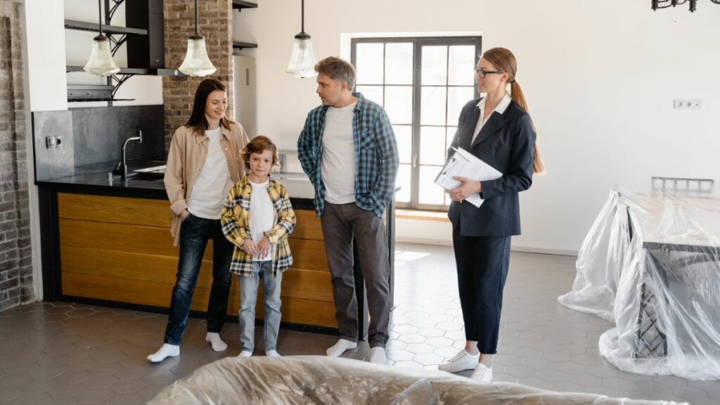 Woman realtor showing family a house