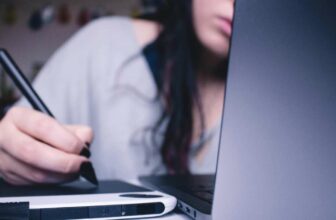 Woman writing on tablet